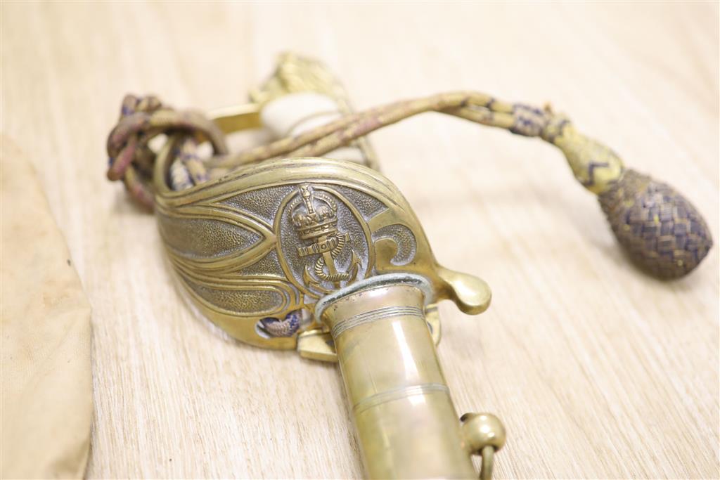 A George V Naval officers sword, by J R Gaunt & Son, Serial No. 16427 together with scabbard and leather case